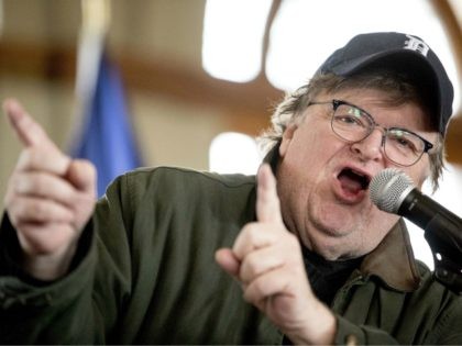 Filmmaker Michael Moore speaks at a campaign stop for Democratic presidential candidate former Sen. Bernie Sanders, I-Vt., at a campaign stop at La Poste, Sunday, Jan. 26, 2020, in Perry, Iowa. (AP Photo/Andrew Harnik)