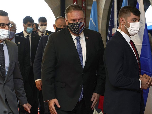 US Secretary of State Mike Pompeo (C) arrives for a tour of the Friends of Zion Museum on November 20, 2020, in Jerusalem. - US Secretary of State Mike Pompeo became the first top American diplomat to visit a West Bank Jewish settlement and the Golan Heights, cementing Donald Trump's …