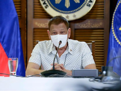In this photo provided by the Malacanang Presidential Photographers Division, Philippine President Rodrigo Duterte wears a protective mask as he meets members of the Inter-Agency Task Force on the Emerging Infectious Diseases in Davao province, southern Philippines on Monday Sept. 21, 2020. Duterte says he has extended a state of …
