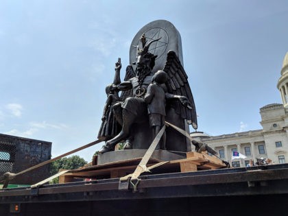 The Satanic Temple unveils its statue of Baphomet, a winged-goat creature, at a rally for