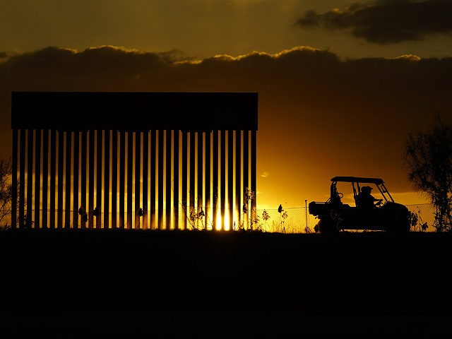 Authorities pass a border wall construction site, in Mission, Texas, Monday, Nov. 16, 2020. President-elect Joe Biden will face immediate pressure to fulfill his pledge to stop border wall construction. But he will confront a series of tough choices left behind by President Donald Trump, who's ramped up construction in …