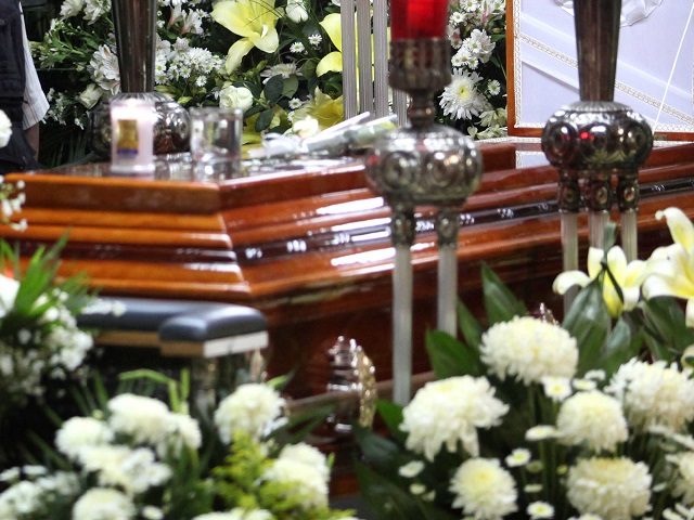 A mourner stands next to the coffin containing the remains of slain journalist Victor Manuel Baez during his wake in Xalapa, Mexico, Friday, June 15, 2012. Baez is the fifth journalist to be killed in just over a month in Veracruz, one of the states most affected by drug violence …