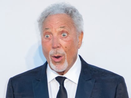 Tom Jones poses for photographers upon arrival at the amfAR, Cinema Against AIDS, benefit