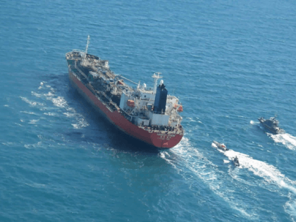 In this photo released Monday, Jan. 4, 2021, by Tasnim News Agency, a seized South Korean-flagged tanker is escorted by Iranian Revolutionary Guard boats on the Persian Gulf. Iranian state television acknowledged that Tehran seized the oil tanker in the Strait of Hormuz. The report on Monday alleged the MT …