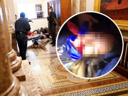 U.S. Capitol Police hold protesters at gun-point near the House Chamber inside the U.S. Ca