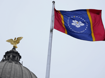 The new Mississippi state flag flies under the eagle at the top of the Capitol rotunda following the ceremonial unfurling in Jackson, Monday, Jan. 11, 2021. Earlier in the afternoon, Republican Gov. Tate Reeves signed a law that created the new state flag with magnolia at the center, six months …