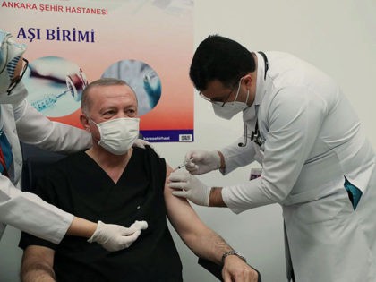 Turkey's President Recep Tayyip Erdogan receives a shot of the COVID-19 vaccination, a day after Turkish authorities gave the go-ahead for the emergency use of the COVID-19 vaccine produced by China's Sinovac Biotch Ltd., in Ankara, Turkey, Thursday, Jan. 14, 2021. Turkey became the latest country to roll out its …