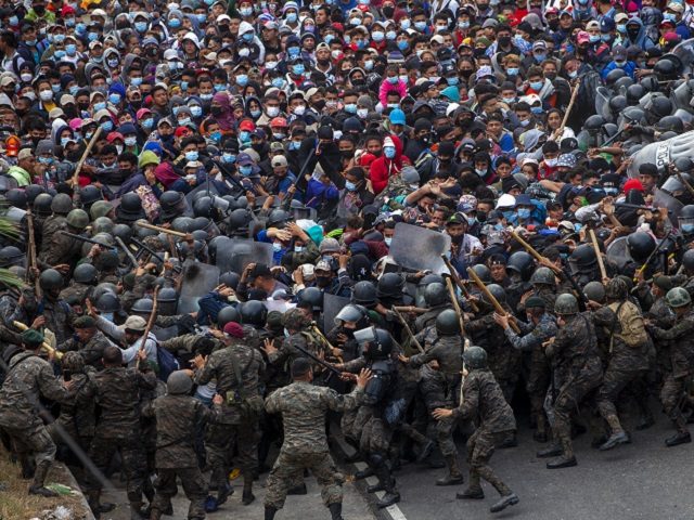 Honduran migrants clash with Guatemalan soldiers in Vado Hondo, Guatemala, Sunday, Jan. 17