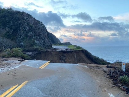 In this photo provided by Caltrans, a section of Highway 1 is collapsed following a heavy