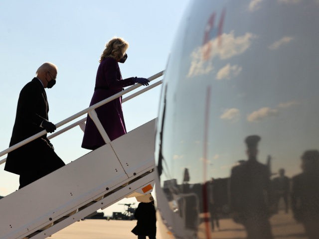 NEW CASTLE, DELAWARE - JANUARY 19: President-elect Joe Biden (L) and Dr. Jill Biden board a flight for Washington at the New Castle County Airport on day before being inaugurated as the 46th president of the United States January 19, 2021 in New Castle, Delaware. After arriving in the nation's …