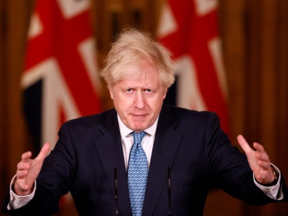 LONDON, ENGLAND - DECEMBER 21: Britain's Prime Minister, Boris Johnson speaks during a virtual press conference inside 10 Downing Street after a string of countries banned travellers and all but unaccompanied freight arriving from the UK, due to the rapid spread of a new, more-infectious coronavirus strain on December 21, …