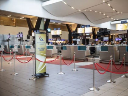 Empty SAA (South African Airways) check-in counters are seen at the O.R. Tambo International Airport in Johannesburg, South Africa, on November 15, 2019. - The South African airline company has cancelled nearly all its domestic, regional and international flights scheduled for November 15, 2019 and November 16, 2019 following the …