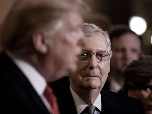 WASHINGTON, DC - JANUARY 09: US President Donald Trump (L) talks to the press as Senate Majority Leader Mitch McConnell (R-KY) looks on after the Republican luncheon at the U.S. Capitol Building on January 9, 2019 in Washington, DC. (Photo by Olivier Douliery-Pool/Getty Images)