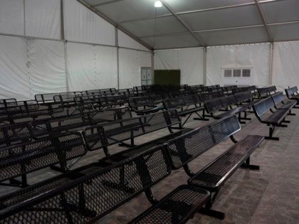 This photo shows the intake area for migrants waiting to be processed at the new temporary holding facility opened by Customs and Border Protection in El Paso, Texas, on May 2, 2019. - The facility is meant to address the record number of families and children apprehended crossing the US-Mexico …