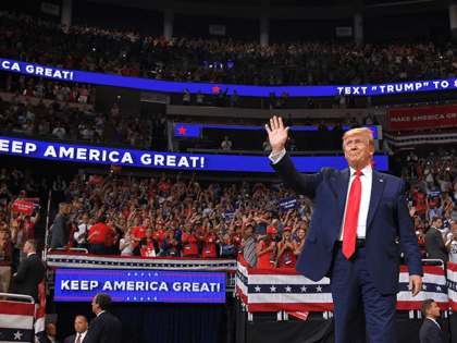 US President Donald Trump arrives to speak during a rally at the Amway Center in Orlando,