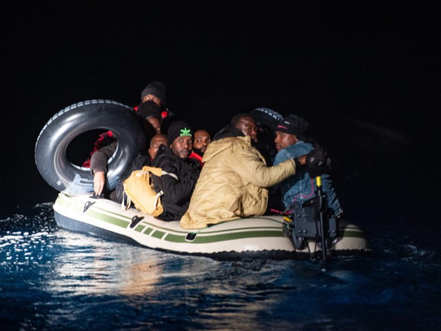 BODRUM, TURKEY - NOVEMBER 15: Migrants and refugees are seen on an inflatable boat during