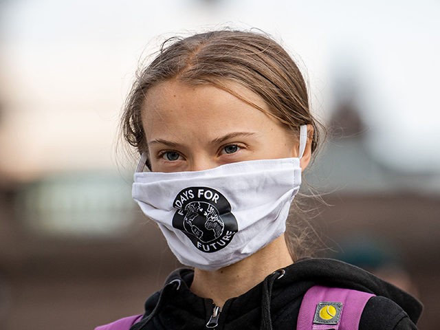 Swedish climate activist Greta Thunberg takes part in a Fridays For Future protest in fron