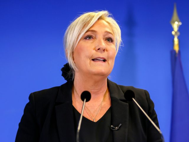 Head of far-right party Rassemblement National Marine Le Pen speaks to the press three days after the beheading of history teacher Samuel Paty, at the RN party headquarters in Nanterre, near Paris, on October 19, 2020. - Paty, 47, was murdered on his way home from the school where he …