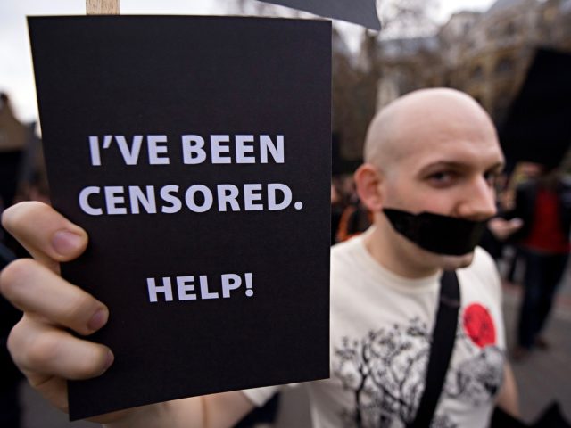 Demonstrators protest outside the Houses of Parliament in London against the proposed Digital Rights Bill, on March 24, 2010. The Open Rights Group organised the event to highlight what they believe to be a potential threat to freedom of speech and information through restrictions and disconnections of people believed to …