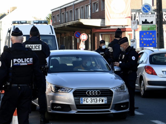 French police control drivers' statements allowing them to be out of home on November 6, 2020 at the border with Belgium in Quievrechain during a lockdown imposed by French authorities in an attempt to halt the spread of the Covid-19. (Photo by FRANCOIS LO PRESTI / AFP) (Photo by FRANCOIS …
