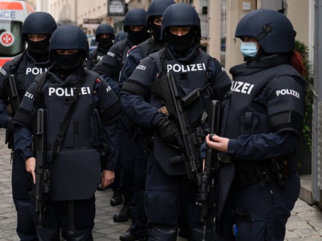 Armed police officers stand guard before the arrival of Austrian Chancellor Kurz and President of the European Council to pay respects to the victims of the recent terrorist attack in Vienna, Austria on November 9,2020. (Photo by JOE KLAMAR / AFP) (Photo by JOE KLAMAR/AFP via Getty Images)
