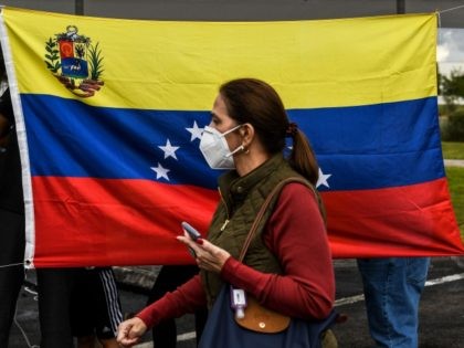 Venezuelan citizens participate in the vote for the popular consultation, as part of a pro