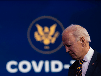 U.S. President-elect Joe Biden departs after delivering remarks on the ongoing coronavirus (COVID-19) pandemic at the Queen Theater on December 29, 2020 in Wilmington, Delaware. Biden will be inaugurated as the 46th president in a scaled-down ceremony due to the pandemic in Washington D.C. on January 20, 2021. (Photo by …