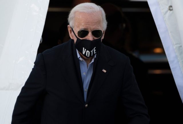 US President-elect Joe Biden, wearing a face mask with the word "Vote" printed o
