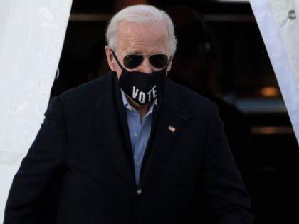 US President-elect Joe Biden, wearing a face mask with the word "Vote" printed o