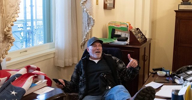 PHOTO Protester Sits in House Speaker Pelosi's Office