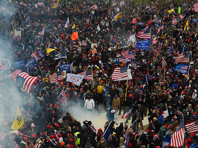 Trump supporters clash with police and security forces as they storm the US Capitol in Washington D.C on January 6, 2021. - Demonstrators breeched security and entered the Capitol as Congress debated the a 2020 presidential election Electoral Vote Certification. (Photo by ROBERTO SCHMIDT / AFP) (Photo by ROBERTO SCHMIDT/AFP …