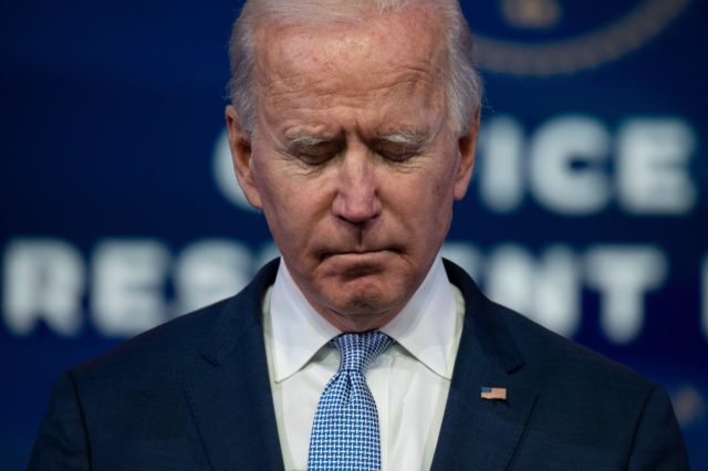 TOPSHOT - US President-elect Joe Biden speaks at the Queen Theater on January 6, 2021, in Wilmington, Delaware. - Biden on Wednesday denounced the storming of the US Capitol as an "insurrection" and demanded President Donald Trump go on television to call an end to the violent "siege." (Photo by …