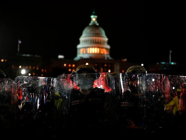 Members of the DC National Guard are deployed outside of the US Capitol in Washington DC on January 6, 2021. - Donald Trump's supporters stormed a session of Congress held today, January 6, to certify Joe Biden's election win, triggering unprecedented chaos and violence at the heart of American democracy …