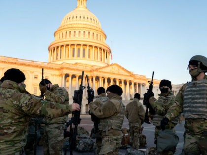 Weapons are distributed to members of the National Guard outside the U.S. Capitol on January 13, 2021 in Washington, DC. (Photo by Stefani Reynolds/Getty Images)
