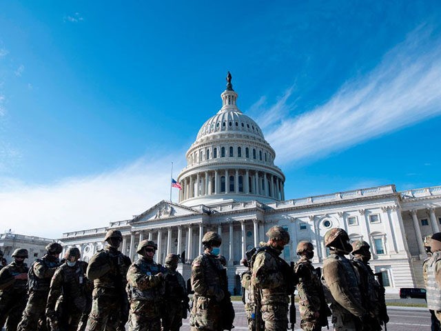 Members of the US National Guard arrive as the US Capitol goes into lockdown after an "external security threat" prior to a dress rehearsal for the 59th inaugural ceremony for President-elect Joe Biden and Vice President-elect Kamala Harris at the US Capitol on January 18, 2021 in Washington, DC. - …