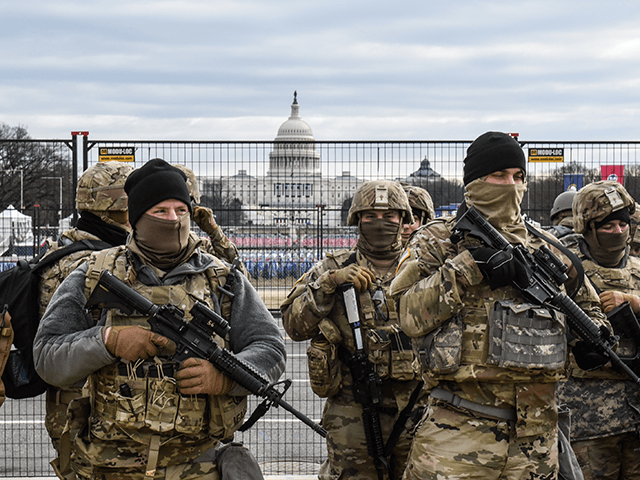 Members of the National Guard patrol the National Mall on January 19, 2021 in Washington,