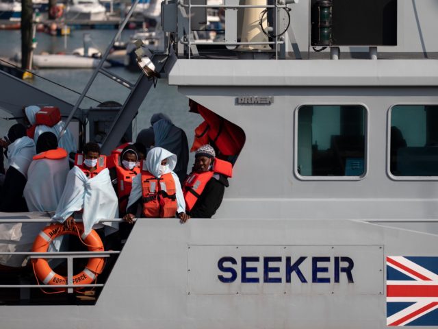 DOVER, ENGLAND - SEPTEMBER 22: Migrants on board HMC Seeker after being intercepted in the English Channel by border foce on September 22, 2020 in Dover, England. This summer has seen an increase in people making the journey in small crafts from France seeking asylum in U.K. (Photo by Luke …