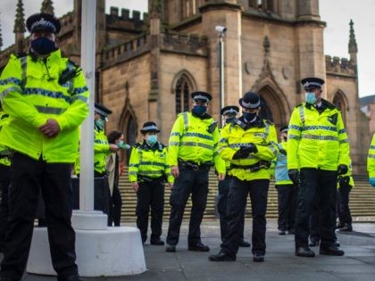 LIVERPOOL, ENGLAND - NOVEMBER 14: Police officers patrol Bold Street during an anti lockdown protest on November 14, 2020 in Liverpool, England. Throughout the Covid-19 pandemic, there have been recurring protests across England against lockdown restrictions and other rules meant to curb the spread of the virus. Police in Liverpool …