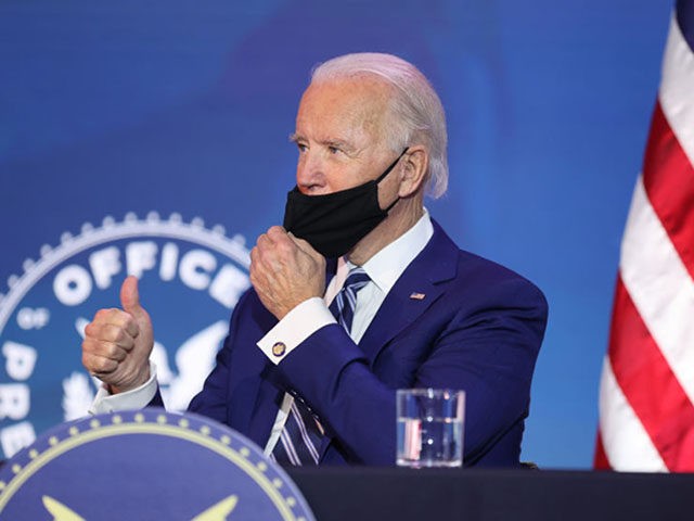 WILMINGTON, DELAWARE - DECEMBER 09: U.S. President-elect Joe Biden gives the thumbs-up as he adjusts his mask after he announced U.S. Army (retired) General Lloyd Austin as his choice to be Secretary of the Department of Defense at the Queen Theatre on December 09, 2020 in Wilmington, Delaware. The only …