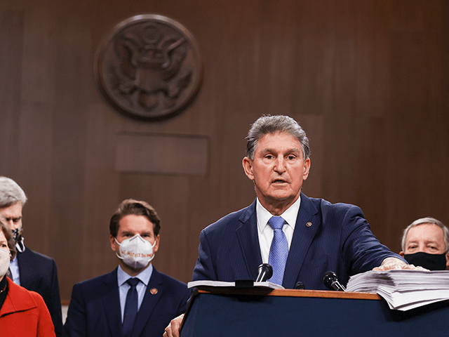 Sen. Joe Manchin (D-WV) speaks alongside a bipartisan group of Democrat and Republican members of Congress as they announce a proposal for a Covid-19 relief bill on Capitol Hill on December 14, 2020 in Washington, DC. Lawmakers from both chambers released a $908 billion package Monday, split into two bills. …