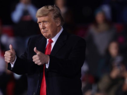 DALTON, GEORGIA - JANUARY 04: U.S. President Donald Trump holds two thumbs up during a Republican National Committee Victory Rally at Dalton Regional Airport January 4, 2021 in Dalton, Georgia. President Trump campaigned for the two incumbents, Sen. David Perdue (R-GA) and Sen. Kelly Loeffler (R-GA), for tomorrow’s runoff elections …