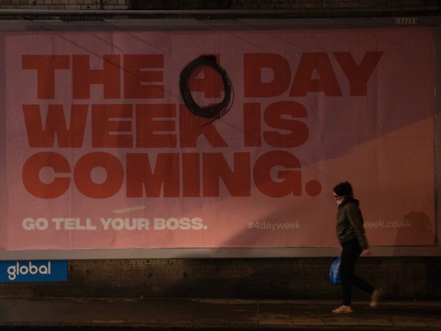 LONDON, ENGLAND - JANUARY 05: A billboard advertising a four day week, that has been altered to say 'The 0 day week is coming' on January 05, 2021 in London, England. British Prime Minister made a national television address on Monday evening announcing England is to enter its third coronavirus …