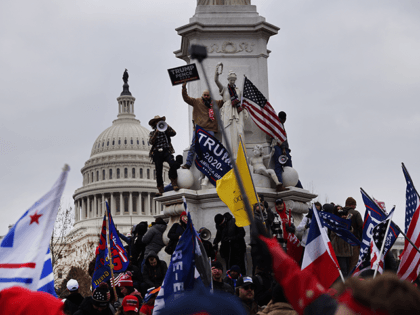 Trump supporters gather outside the U.S. Capitol building following a "Stop the Steal" ral
