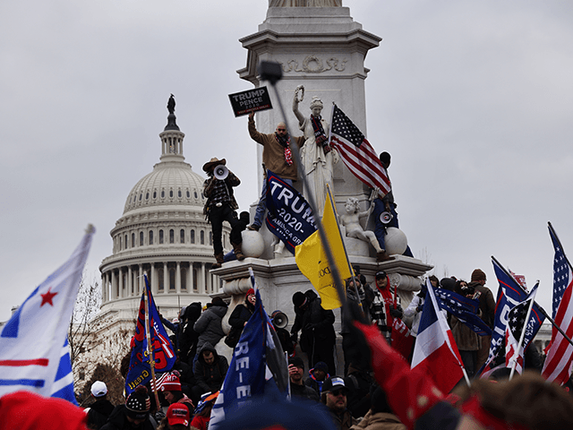 Trump supporters gather outside the U.S. Capitol building following a "Stop the Steal" rally on January 06, 2021 in Washington, DC. A pro-Trump mob stormed the Capitol earlier, breaking windows and clashing with police officers. Trump supporters gathered in the nation's capital to protest the ratification of President-elect Joe Biden's …