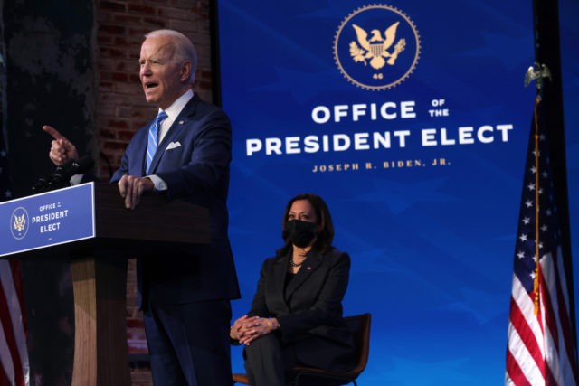 WILMINGTON, DELAWARE - JANUARY 14: U.S. Vice President-elect Kamala Harris (R) looks on as U.S. President-elect Joe Biden (L) lays out his plan for combating the coronavirus and jump-starting the nation’s economy at the Queen theater January 14, 2021 in Wilmington, Delaware. President-elect Biden is expected to unveil a stimulus …