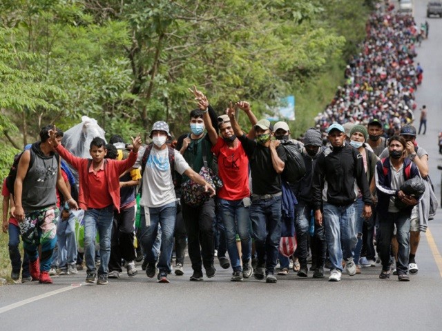 EL FLORIDO, GUATEMALA - JANUARY 16: Migrants enter Guatemala after breaking a police barricade at the border checkpoint on January 16, 2021 in El Florido, Guatemala. The caravan departed from Honduras to walk across Guatemala and Mexico to eventually reach the United States. Central Americans expect to receive asylum and most Hondurans decided to migrate after being hit by recent hurricanes Eta and Iota. Honduras recently asked to U.S. to extend their Temporary Protected Status. (Photo by Josue Decavele/Getty Images)