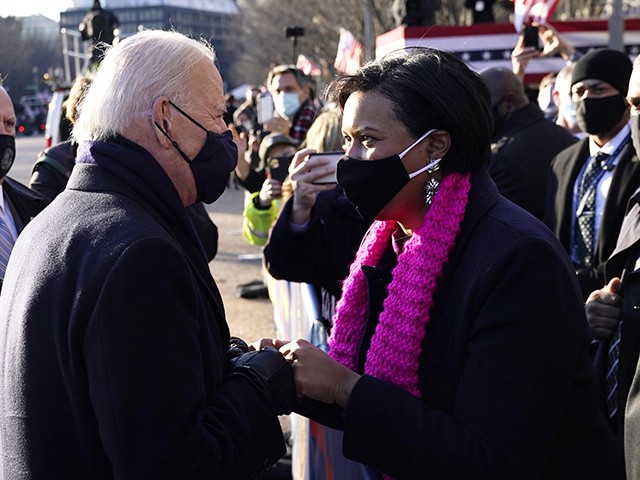 WASHINGTON, DC - JANUARY 20: U.S. President Joe Biden greets DC Mayor Muriel Bowser on the abbreviated parade route after Biden's inauguration on January 20, 2021 in Washington, DC. Biden became the 46th president of the United States earlier today during the ceremony at the U.S. Capitol. (Photo by Drew Angerer/Getty Images)