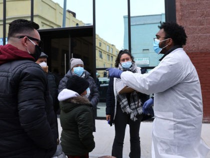 NEW YORK, NEW YORK - JANUARY 22: A medical worker stands outside of a mobile COVID-19 test