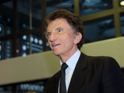 Former French Culture Minister and current President of the Arab World Institute (IMA) Jack Lang attends an award giving ceremony at IMA on March 13, 2015 in Paris. French television and radio show host and producer Eve Ruggieri was awarded by Lang on March 13 with the insignia of Officer …