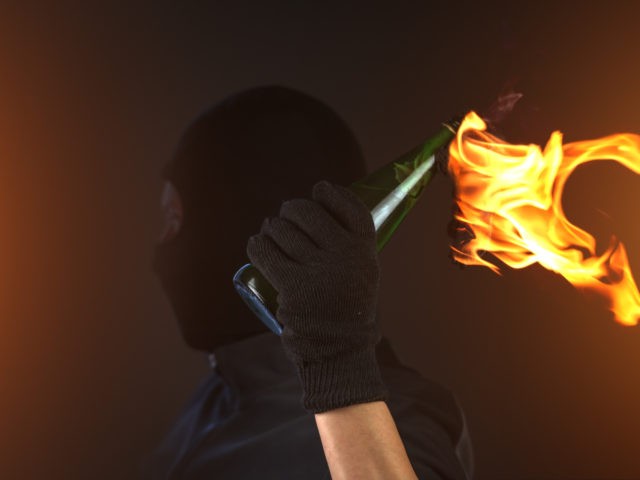 molotov cocktail in activist hand